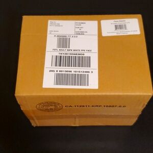 Unopened box of white face masks